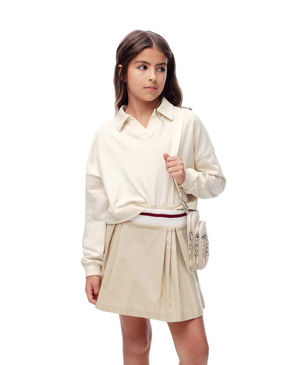 Falda corta con pliegues beige niña